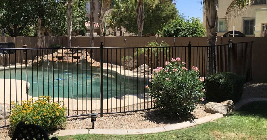 iron fence around swimming pool
