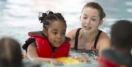 teaching young girl how to swim